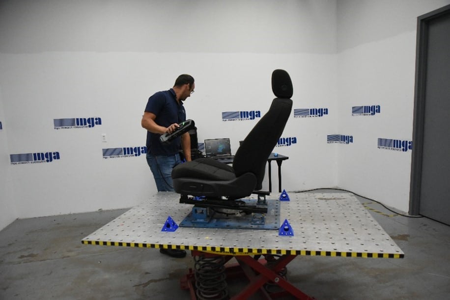 Image 1: MGA analysis expert performs scan on a car seat.